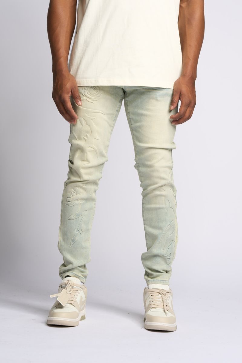 "LOVE IS PAIN" EMBOSSED SKINNY DENIM