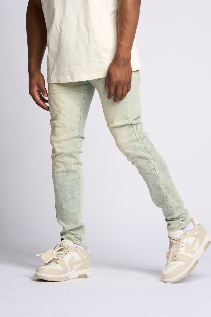 "LOVE IS PAIN" EMBOSSED SKINNY DENIM