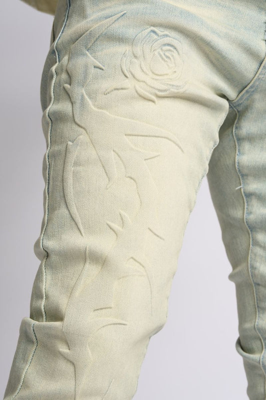 "LOVE IS PAIN" EMBOSSED SKINNY DENIM