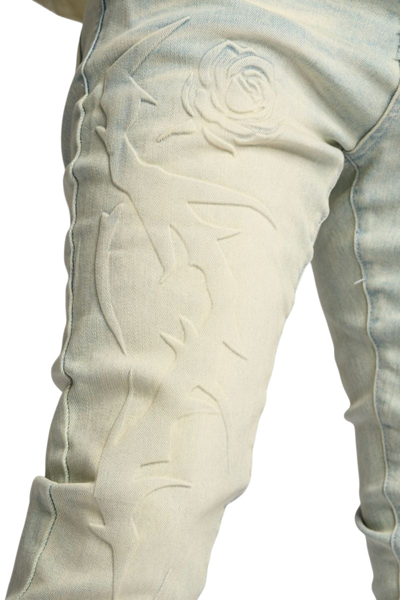 "LOVE IS PAIN" EMBOSSED SKINNY DENIM